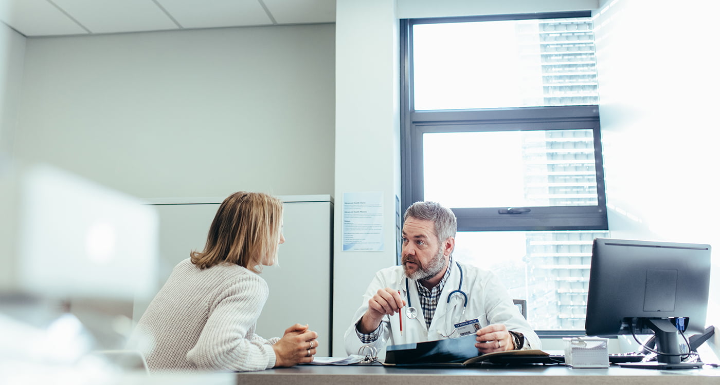 a doctor speaking to his patient